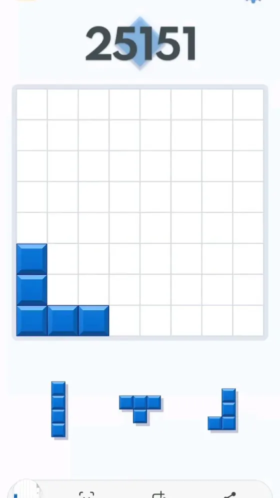 Block Blast style puzzle board with open space and upcoming pieces